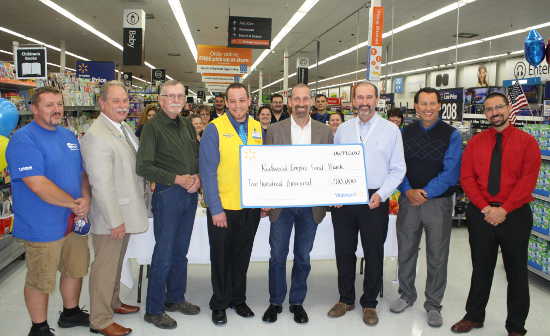 Representatives of Walmart, the nation’s largest grocer, presented a check for $200,000 to the Redwood Empire Food Bank on Wednesday, June 14, 2017, in Clearlake, Calif. Pictured, from left to right, are Clearlake City Councilman Phil Harris, Clearlake Mayor Russ Perdock, Clearlake City Councilman Nick Bennett, Clearlake Walmart Store Manager Travis Peck, Redwood Empire Food Bank Chief Executive Officer David Goodman, Walmart Market Manager Mike Ellison, Clearlake City Manager Greg Folsom and Clearlake City Councilman Bruno Sabatier. Courtesy photo.